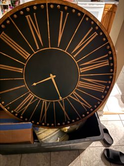Large black and bronze clock