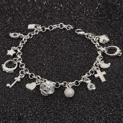 Adorable Silver Bracelet Full Of Charms