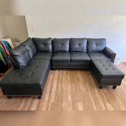 Black Leather sectional sofa with Ottoman