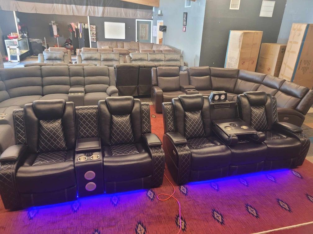 brand new fully loaded power reclining living room sofa and loveseat set, made of leather.