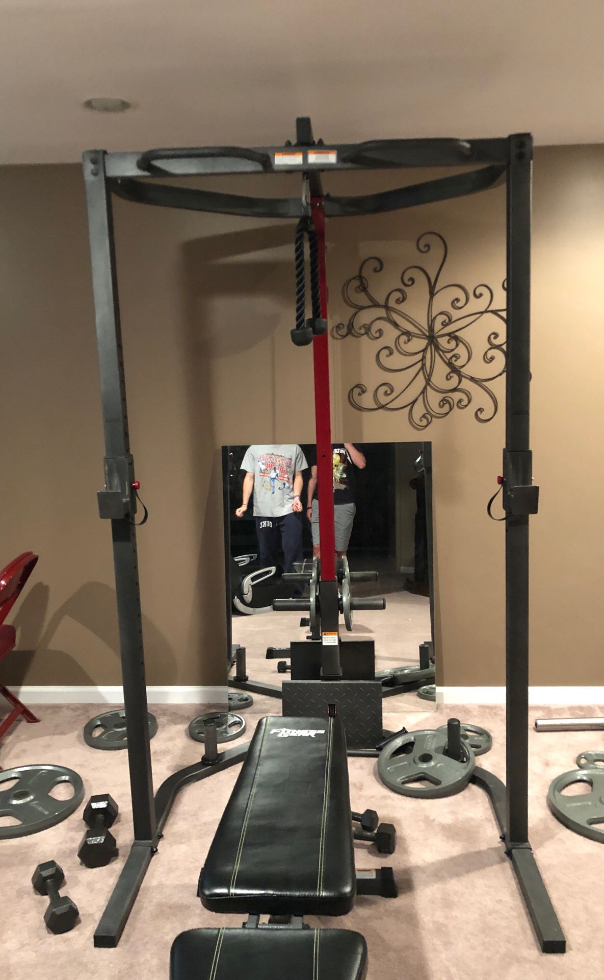 Full basement gym set, free weights and bar weights up to 45 pounds.