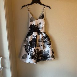 Brand New Woman’s Crystal Doll brand Black and White colored Floral Criss Cross Dress 