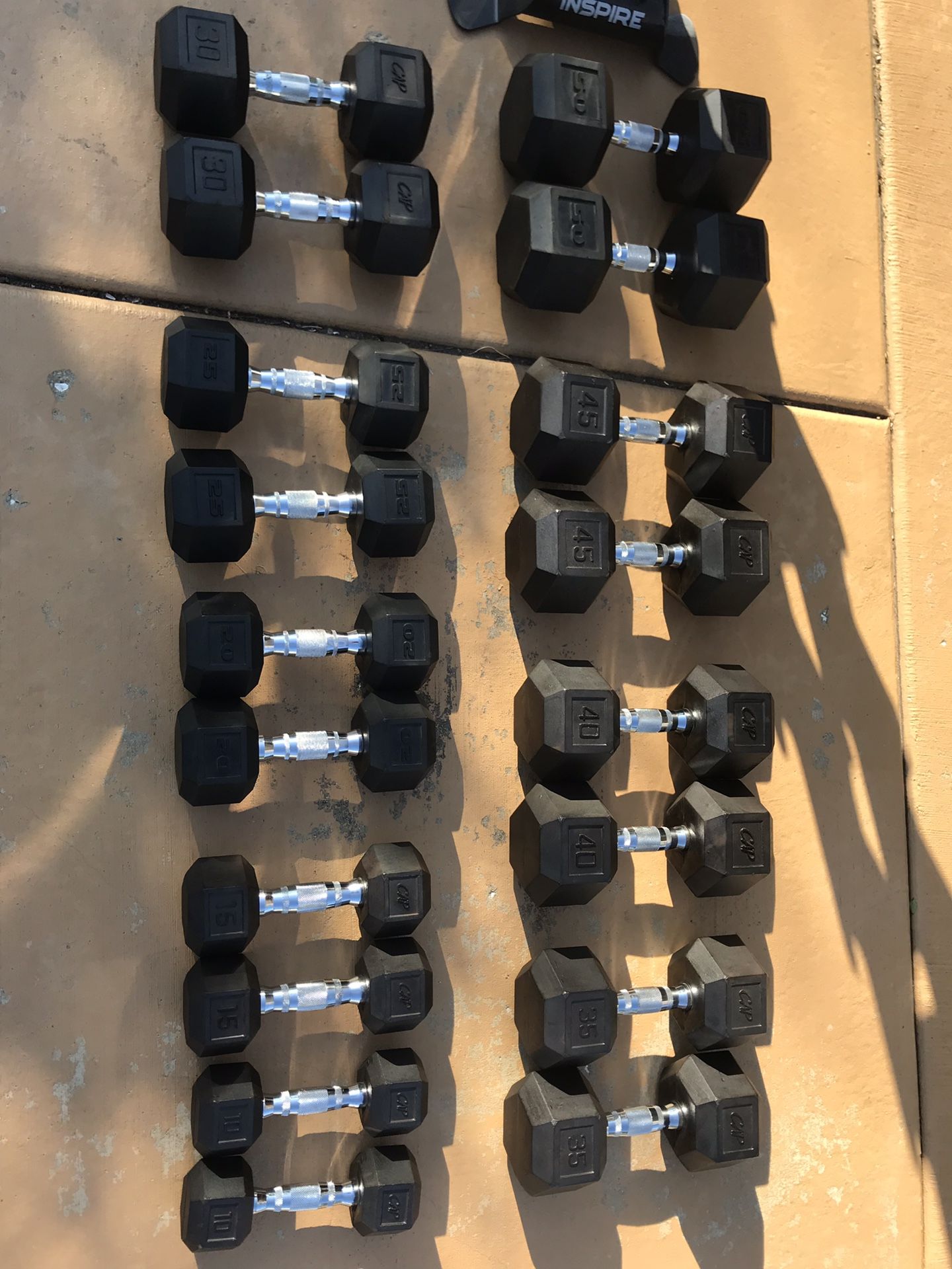 RUBBER ENCASED HEX DUMBBELLS WITH RACK