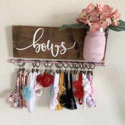 Wooden Bow Holder With Mason Jar And Pink Artificial Flowers