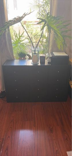 Two dark brown IKEA storage cabinets