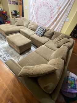 Tan sectional with chaise and ottoman
