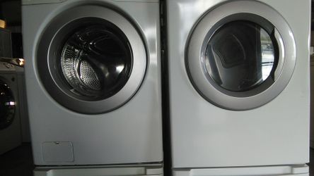 LG front load washer and dryer with pedestal one year warranty delivery available