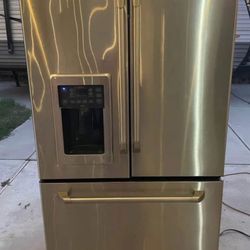 GE Cafe Stainless Steel French Door Fridge  Runs but not cooling. Great for repair or parts.