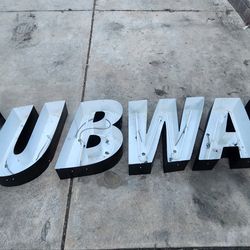 Subway sign has neon tubes intact just needs the plexiglass cover and wired