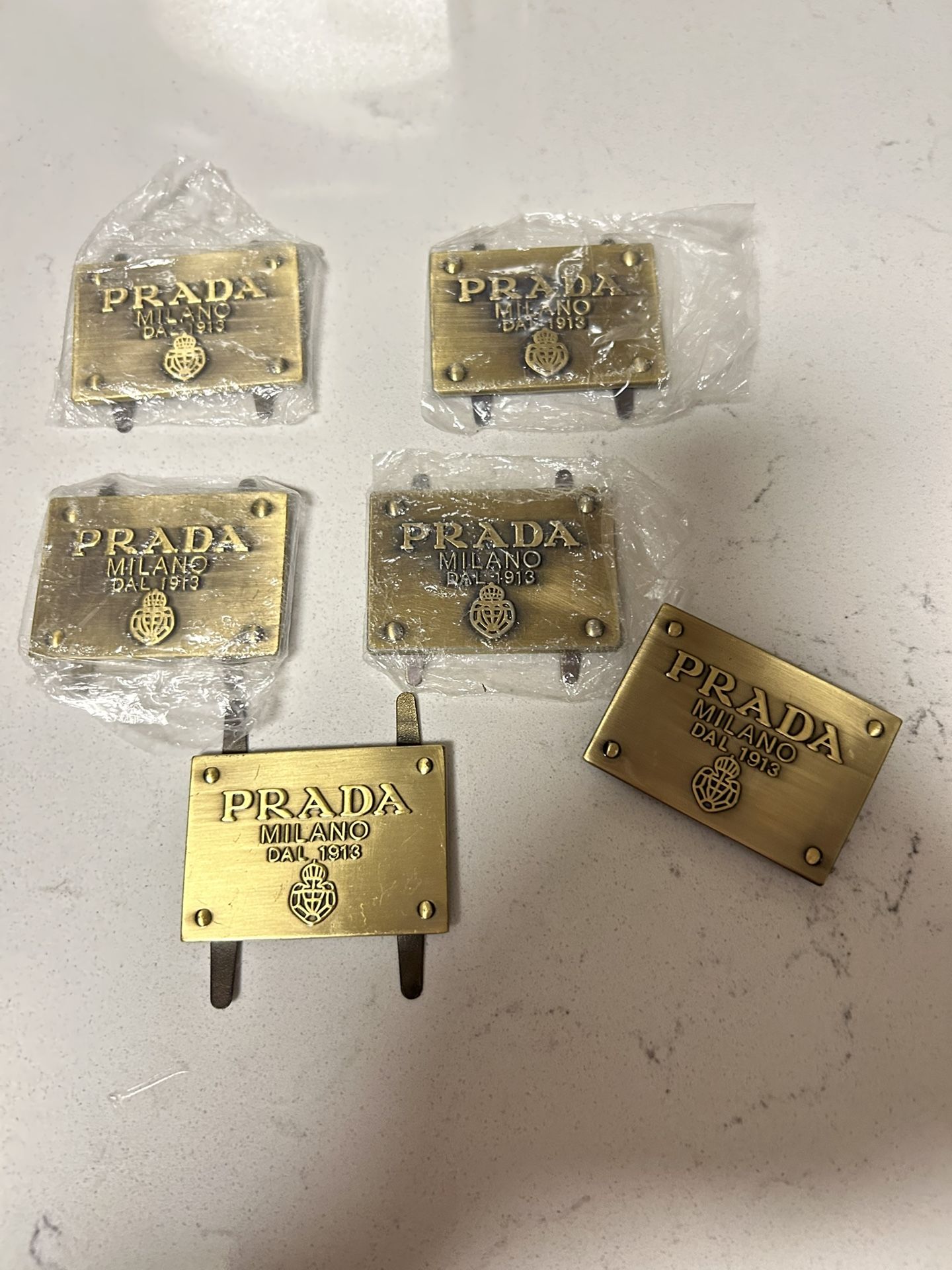 A Variety Set Of Prada Gold Metal Replacement Emblems/tags