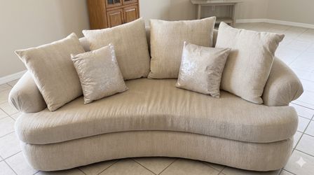 Cream colored curved couch