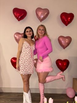 Pink latex knee high boots