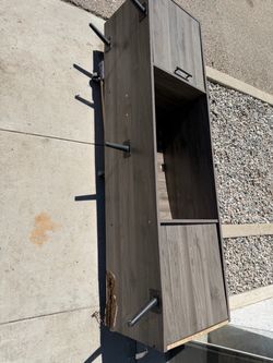 Free TV stand. Has a broken leg. If you want to fix it’s yours