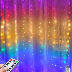 Brand new in pack 320 LED curtain string lights with 8 mode remote and timer.USB powered.