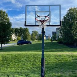 Goaliath 54 inch in ground basketball hoop, adjustable basketball court 