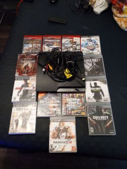 PlayStation console with games and wires no controller's