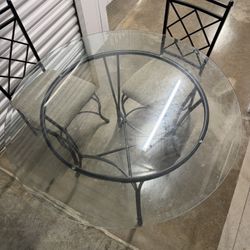 Glass Dinning Table With Iron Chairs