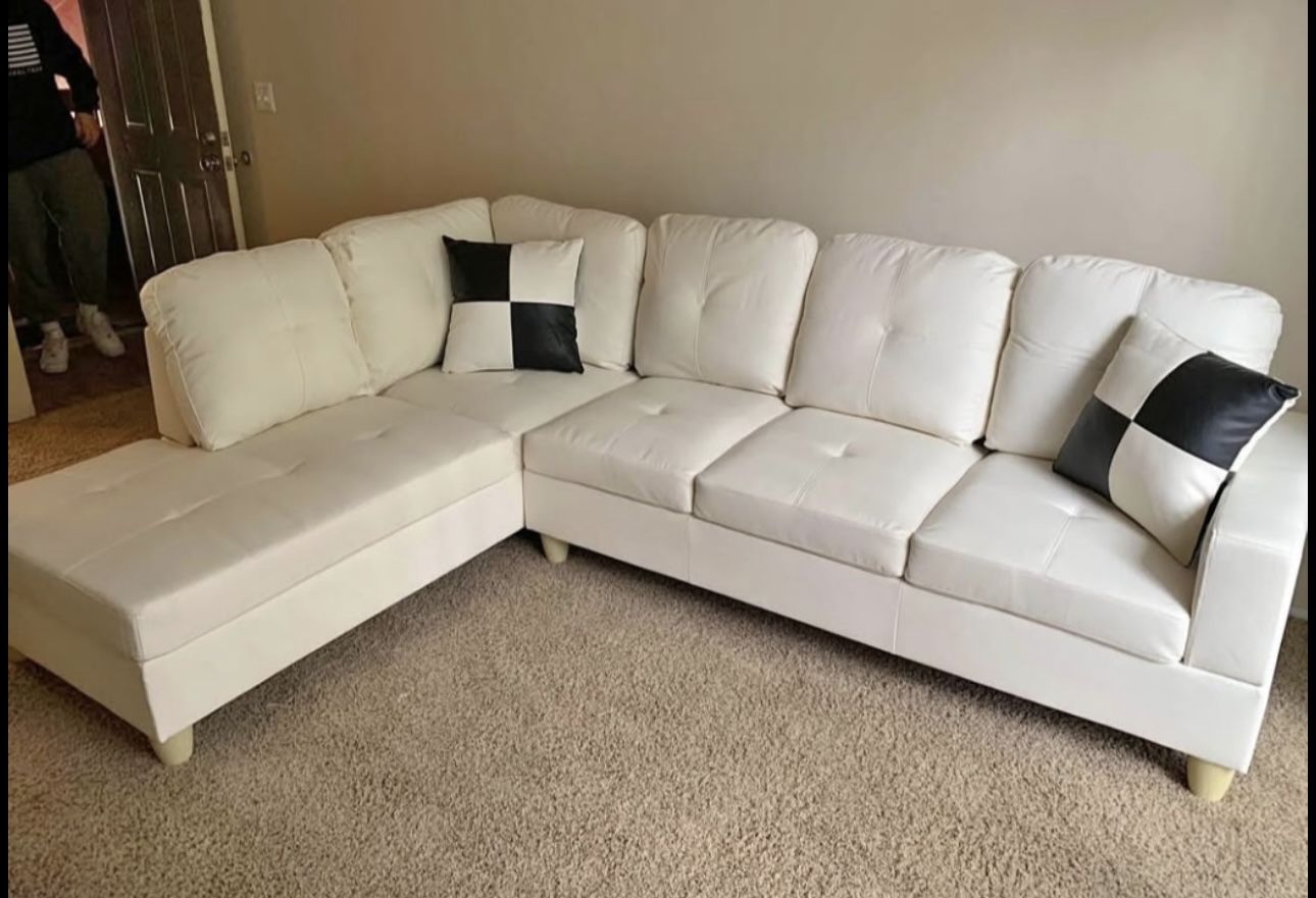 White Leather Sectional Couch And Ottoman