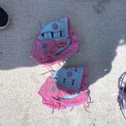 two girls softball gloves
