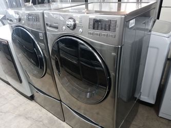 LG gray front load washer and gas dryer set on pedestals - Free delivery