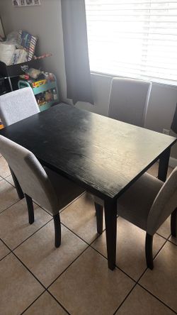 Black Dining table with 4 upholstered chairs