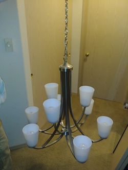 Beautiful 9 light Chandelier, with nickel finish! Like new lightly used for a couple months. Paid 500 asking 225$ i need it gone asap! .