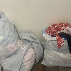 Several bags of girls clothes