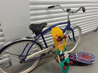 Asking $80 for all five pieces showing bicycle two tennis rackets with their carrying bag and collectible habitat Twin Peaks skateboard