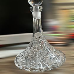 This crystal decanter is absolutely stunning!    Hand Cut Art Glass in a vertical line   crisscross diamond/fan pattern.    Its deep cuts are brillian