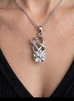 Radiant Double-Heart Solitaire Necklace: Intertwined Hearts with a Brilliant Round Crystal