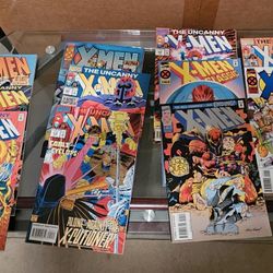 11 XMEN COMICS. Including The Wedding Scott And Jean Grey. Collectable Cards Inside. 