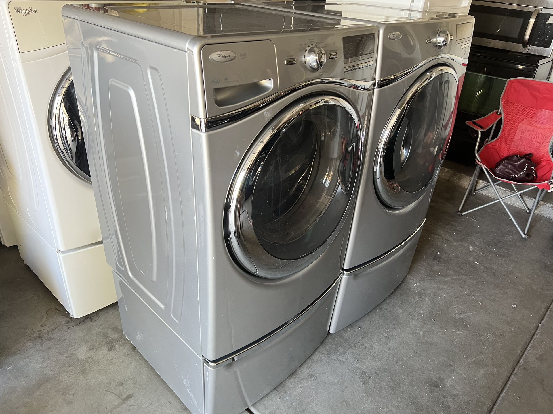 LARGE CAPACITY FRONT LOADING WASHER AND DRYER ON PEDESTALS WITH