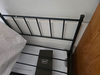 Black bed frame and a mattress like new