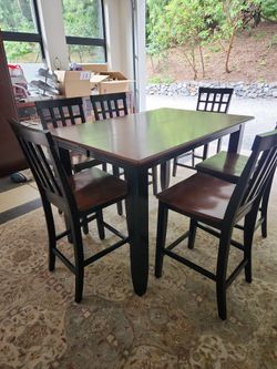 Bar height table with butterfly leaf to accommodate 8 chairs