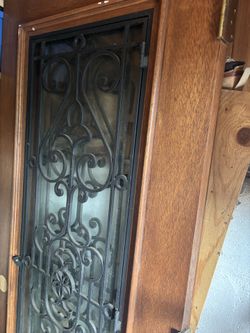 Solid mahogany doors with rod iron inlay