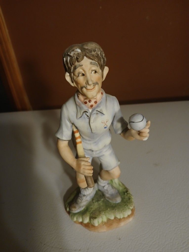 vintage ceramic pickleball player figurine, likely made in Japan. 
