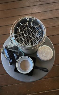 DIY Outdoor Small Firepit with  BBQ Grill top and outer Container. Comes with small Supply of Charcoal, a small Cast Iron Pan and a 3 pc. EverNew Camp