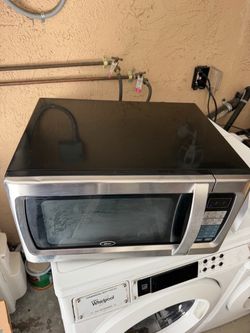 Oster. Model:OGZF 1301. Household Microwave Oven