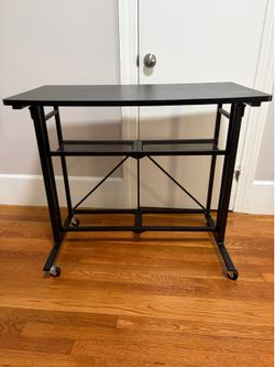 Standing rolling compact desk
