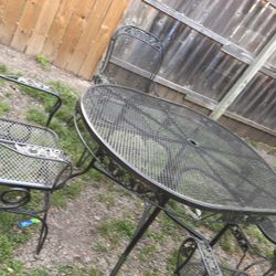 mesa de fierro sillas mesedoras