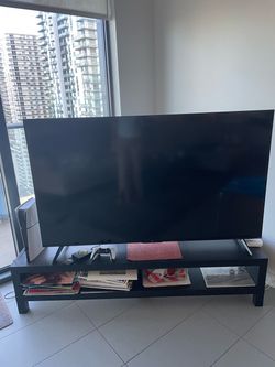 Big TCL TV with Roku remote