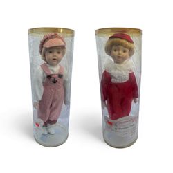 two 16-inch porcelain dolls in their original packaging, likely from a limited or collector's edition. 