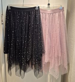 TWO NEW GLITTERY WOMEN SKIRTS LARGE SLIPS READ BELOW