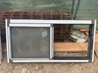 new aluminum sliding window, approximately 47” × 24”, with a screen,