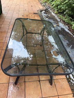 Glass outside table with two chairs