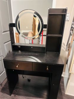 Vanity with lighted mirror