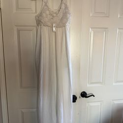White dress with a crochet lace bodice and a light cotton
