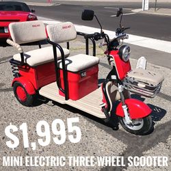 Three-wheeled mini golf cart $1,995 cash price plus taxes.