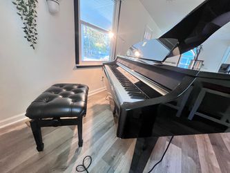 Beautiful Yamaha electric baby grand piano