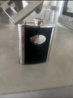 8oz black Flask leather & silver faux … $25 (Has faint monogrammed letters on it)